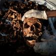 Relatives of victims of Rwanda's 1994 genocide recently recovered remains ahead of a mass burial in Gasabo, a suburb of the capital Kigali, in May 2019
