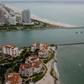 Fisher Island (bottom) in Miami was the home of convicted swindler Anthony Gignac who duped investors by posing as Saudi Prince Khalid Bin Al-Saud