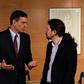 Spanish Prime Minister Pedro Sanchez (L) mets with Podemos party leader Pablo Iglesias whose party he is trying to convince to support him in a confidence vote in parliament next week