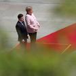 German Chancellor Angela Merkel visibly trembled for minutes while standing in the midday sun next to Ukrainian President Volodymyr Zelensky