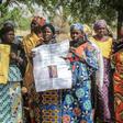 Parents and relatives hold pictures of girls missing since they were abducted by Boko Haram on April 14, 2014 in Chibok, northern Nigeria