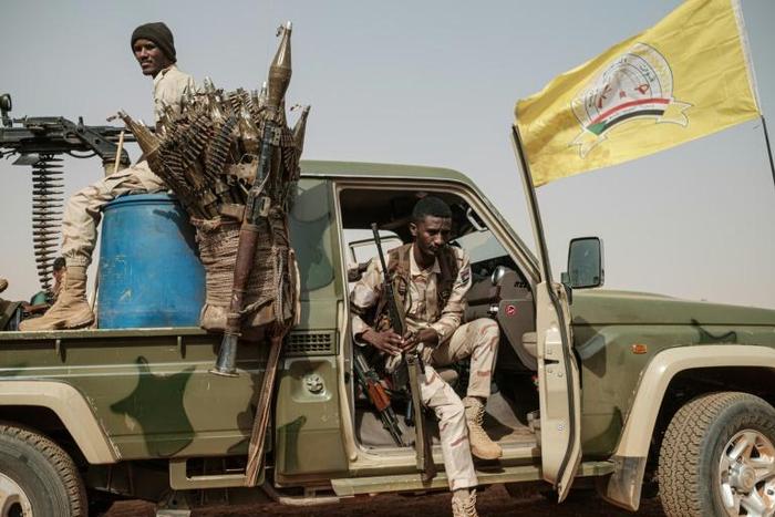 Members of the Rapid Support Forces secure a rally for supporters of Sudan's ruling Transitional Military Council in the village of Abraq, about 60 kilometers northwest of Khartoum, last month