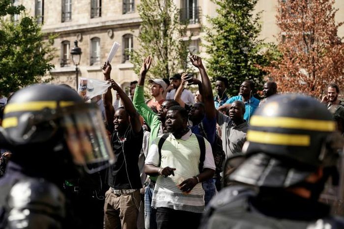 Undocumented migrants and supporters surged into the Pantheon memorial in Paris to demand that their situations be regularised