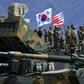 South Korean and US soldiers observe a live fire drill at the Seungjin Fire Training Field in Pocheon, 65 kms northeast of Seoul, in April 2017, before the joint exercises were postponed