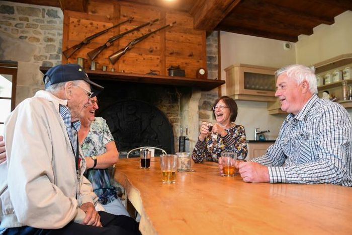 95 year-old WWII US veteran James Carroll (L) returned to the town he helped liberate from the Nazis 75 years ago to stay with his 'second family' there for the second year running