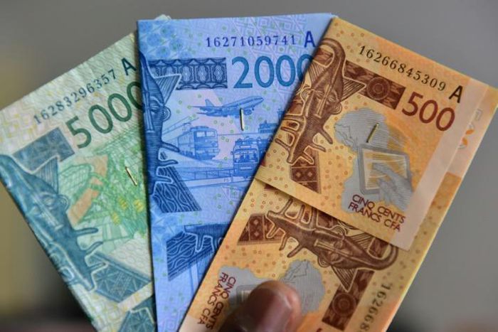 Some economists urge West Africa to hold on to national currencies