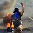 Honduran colleges students block a road in the capital Tegucigalpa during a protest against the government of President Juan Orlando Hernandez