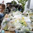 People continued to pay tribute to the victims on Saturday, leaving flowers