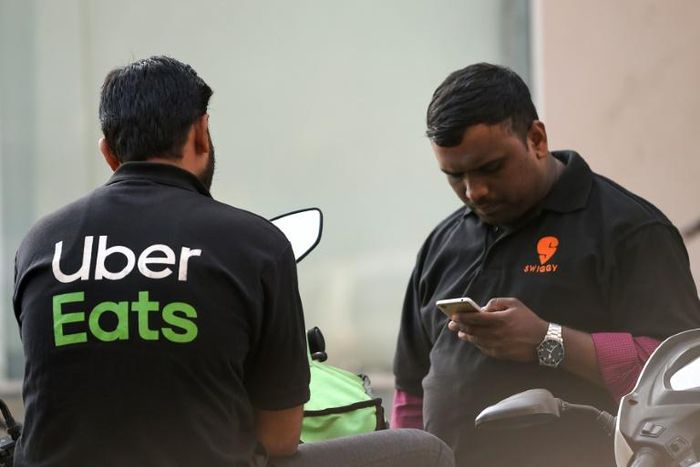 The green part of Uber Eats' logo, pictured here on a delivery driver, will be changed on the Marseille team's jersey after fans complained it was too reminiscent of hated rival Saint-Etienne