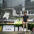 Hong Kong democracy activist Joshua Wong poses during an interview with AFP outside the government headquarters