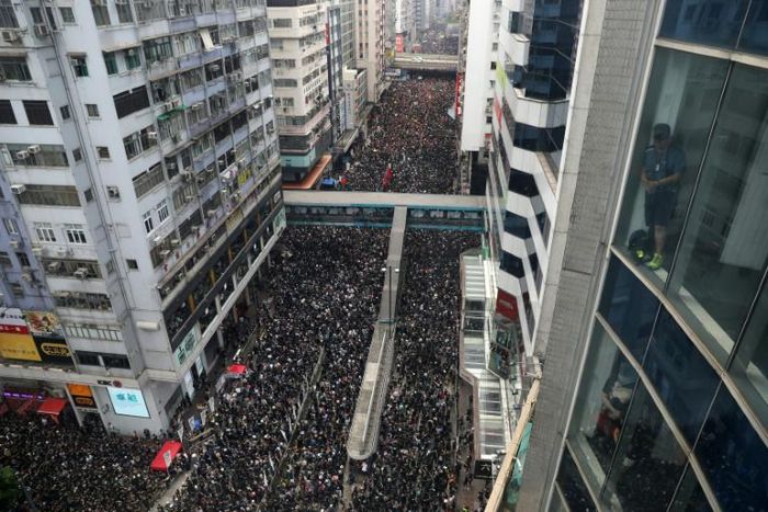 Thousands of protesters dressed in black rallied against Hong Kong's government