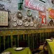 A waiter waits for clients at San Cristobal restaurant in Havana, enduring a slowdown blamed on new US sanctions