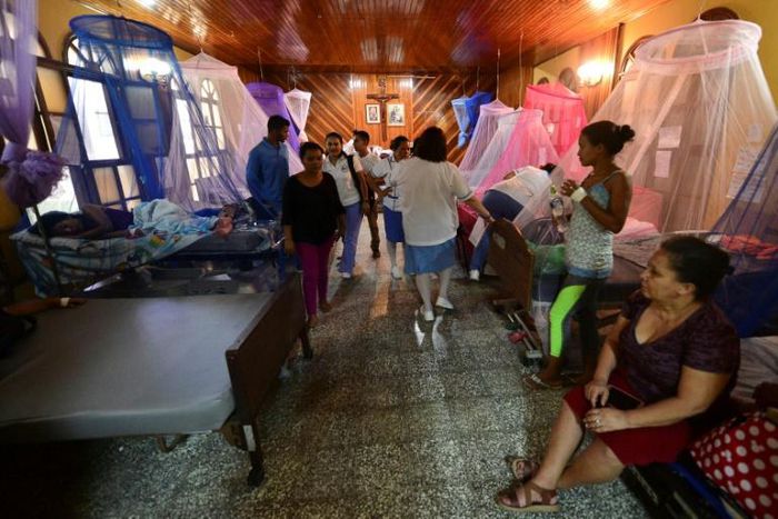 Patients infected with dengue fever receive treatment in a hospital chapel in La Paz, in the west of Honduras