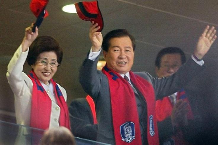 Lee Hee-ho and her late husband Kim Dae-jung wave during the 2002 World Cup in Seoul