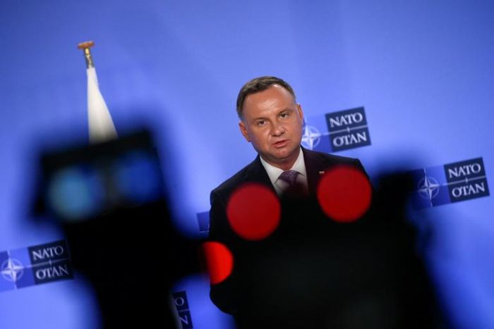 Polish President Andrzej Duda, seen speaking at a NATO conference in June, has pushed strongly for a permanent US military presence in his country