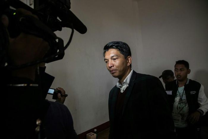 Madagascan President Andry Rajoelina's coalition, in a recent file image, has won an absolute majority in the new parliament, provisional data show, though the opposition is crying foul