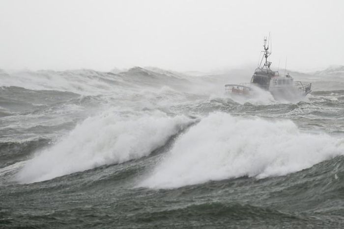 The rescuers were trying to help a fishing boat near the port of La Rochelle