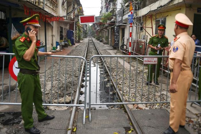 The narrow railway corridor in central Hanoi had become a hotspot among visitors seeking the perfect holiday snap on the atracks - often dodging trains that rumble through daily