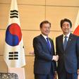 South Korea's President Moon Jae-in in happier times with Japan's Prime Minister Shinzo Abe