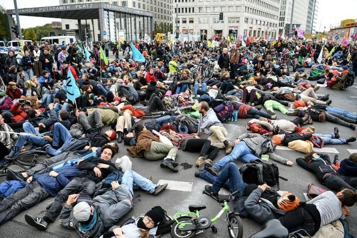 Activists from the "Extinction Rebellion" members demonstrate at Potsdamer Platz square in Berlin