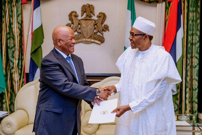 South African special envoy, Jett Radebe (left), with President Muhammadu Buhari (right) [Presidency]