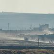 A convoy of Russian and Turkish military vehicles snakes its way along the Syrian side of border in the first joint patrol of a buffer zone set up under an agreement struck by Ankara and Moscow last week