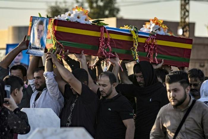 Mourners attend the funeral of five Syrian Democratic Forces fighters killed in battles against Turkey-led forces in the flashpoint town of Ras al-Ain