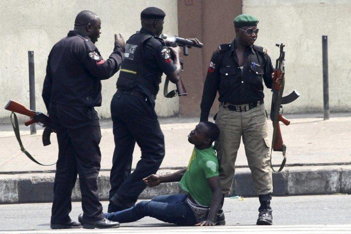 An illustrative photo of police officers beating a suspect. [davinadiaries]