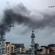 Smoke rises over Gaza City as Israel carries out a second day of air and missile strikes in response to barrages of rocket fire following its targeted killing of a top militant