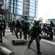 Police clear barricades left by protestors. Clashes between police and activists were less intense than at the start of October when the city was virtually shut down