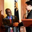 Taiwan Foreign Minister Joseph Wu shakes hands with Solomon Islands' Foreign Minister Jeremiah Manele during a press conference in Taipei. The Solomon Islands is mulling scrapping diplomatic links with Taipei in favour of Beijing