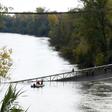 Rescuers search the Tarn river for survivors after   a suspension bridge collapsed