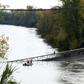 Rescuers search the Tarn river for survivors after   a suspension bridge collapsed