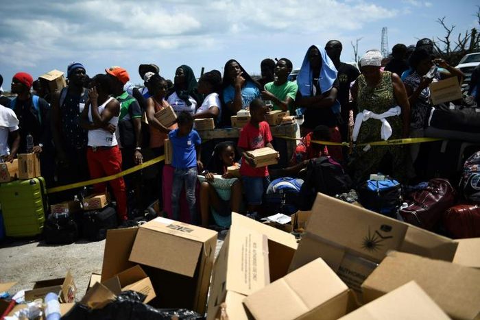 Bahamians waiting to be evacuated from the dock at Marsh Harbour, on the island of Abaco, which was devatsted by hurricane Dorian