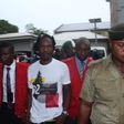 Naira Marley being led to court by men of the EFCC amidst a watertight security. [Twitter/@officialEFCC]