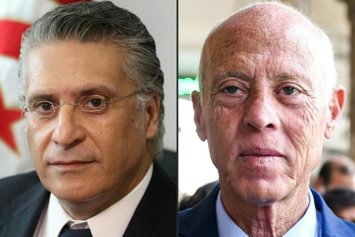 Tunisia presidential frontrunners Nabil Karoui, (L) a media magnate jailed on corruption charges, and law professor Kais Saied
