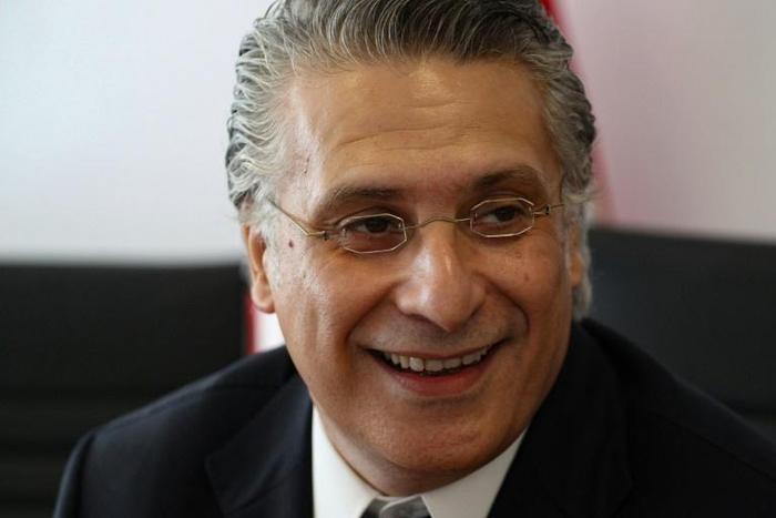 Tunisian presidential candidate Nabil Karoui is continuing his campaign, despite being behind bars on money laundering charges