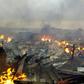 Collapsed stalls burned in the market in Bouake a day after fire broke out in the night