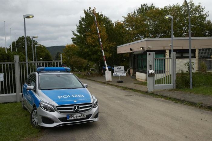 A police car stands in front of the grounds of a former NATO bunker in Traben-Trarbach, western Germany, where a so-called "Bulletproof Hoster" service was located