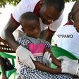 A health worker takes blood from a child in the Ivorian village of Paanenefla -- the sample will be tested for sleeping sickness