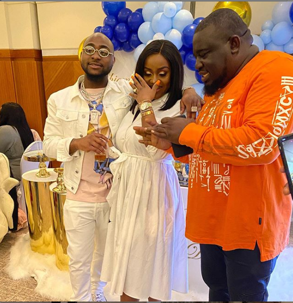 Davido, Chioma and a guest at the naming ceremony in London.