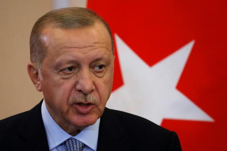 Turkish President Recep Tayyip Erdogan says he will "clear terrorists" from the border between Turkey and northern Syria if Syrian Kurdish militia don't withdraw by Tuesday
