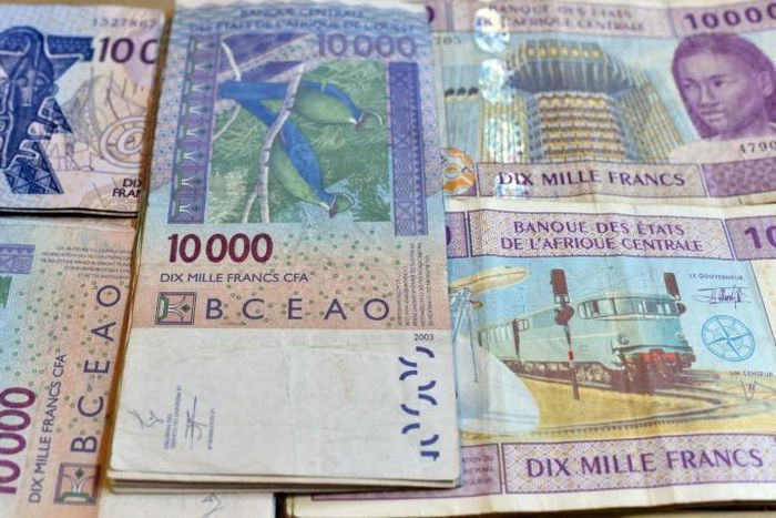 CFA banknotes issued by the  Central Bank of West African States -- but the currency's pegging to the euro is controversial and  politically sensitive, prompting moves to introduce a new currency, the eco