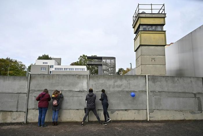 People visit the Berlin Wall memorial on October 3, 2019