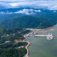 An undated CK Power-issued photo shows shows the Xayaburi dam hydro project on a swollen Mekong river in Laos, but independent images taken downstream paint a different picture