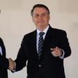 China's President Xi Jinping (L) and Brazil's President Jair Bolsonaro (L) before a summit in Brasilia of the BRICS countries where global trade was on the agenda