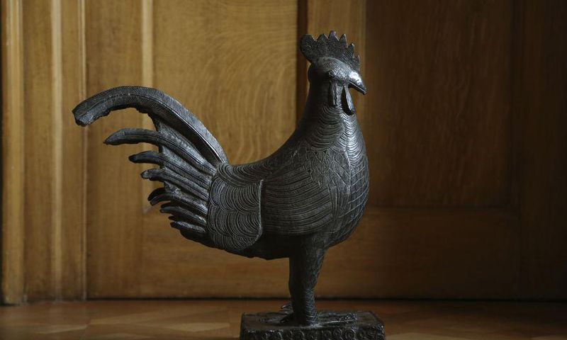 Cambridge University in Britain says it will return the bronze statue that was looted from Nigeria more than a century ago [Chris Loades/Jesus College Cambridge via AP]