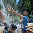 Children cool off at a water park in Alhambra, California on July 27, 2019