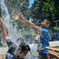 Children cool off at a water park in Alhambra, California on July 27, 2019