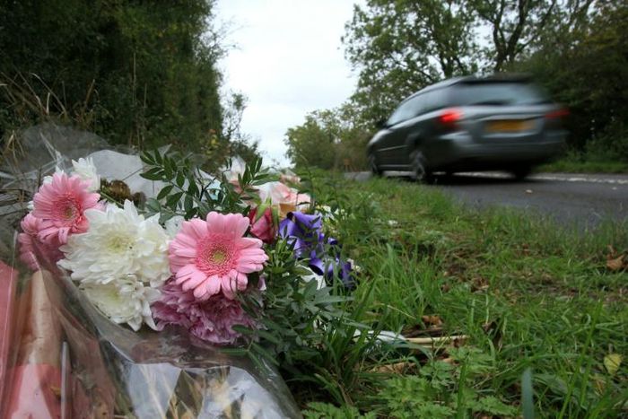 Tributes lie on the roadside near RAF Croughton in Northamptonshire, central England on October 10, 2019, at the spot where Harry Dunn was killed as he travelled along the B4031 on August 27